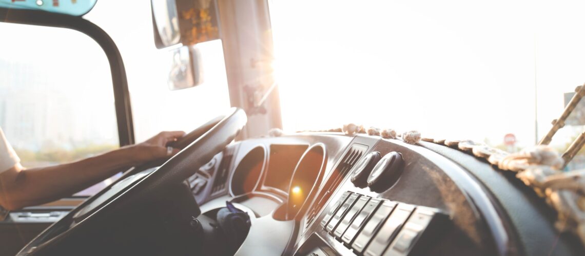 person-hand-on-steering-wheel-977213